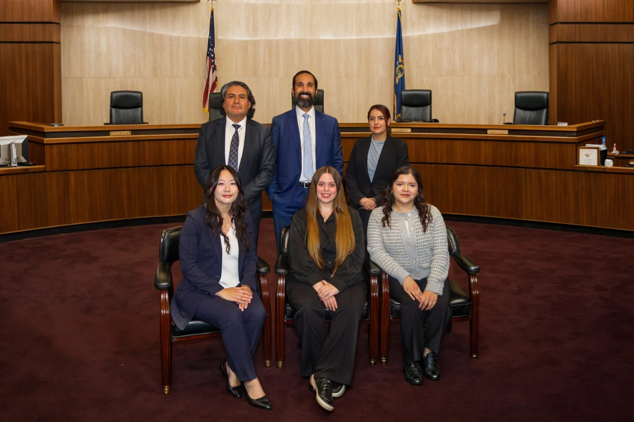 DCD LAW team together inside a courtroom